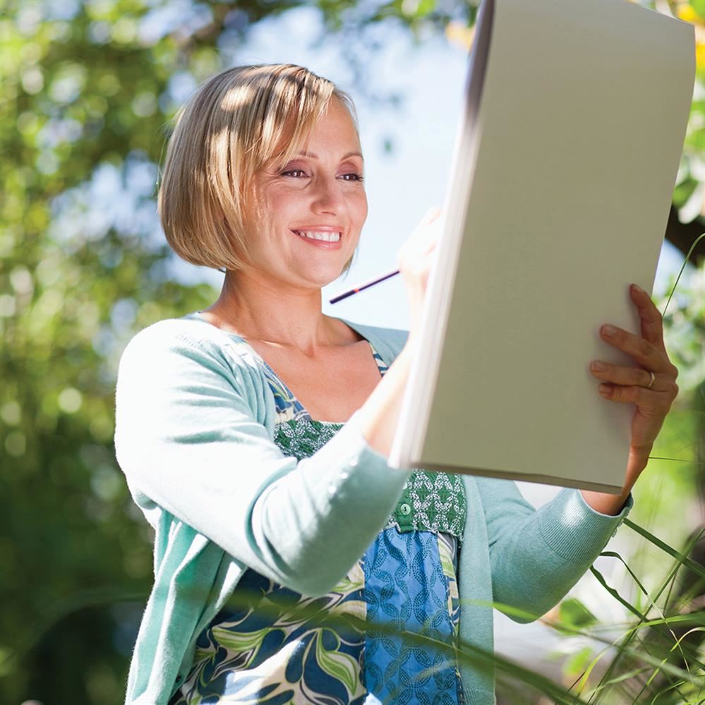 Woman drawing on sketchpad